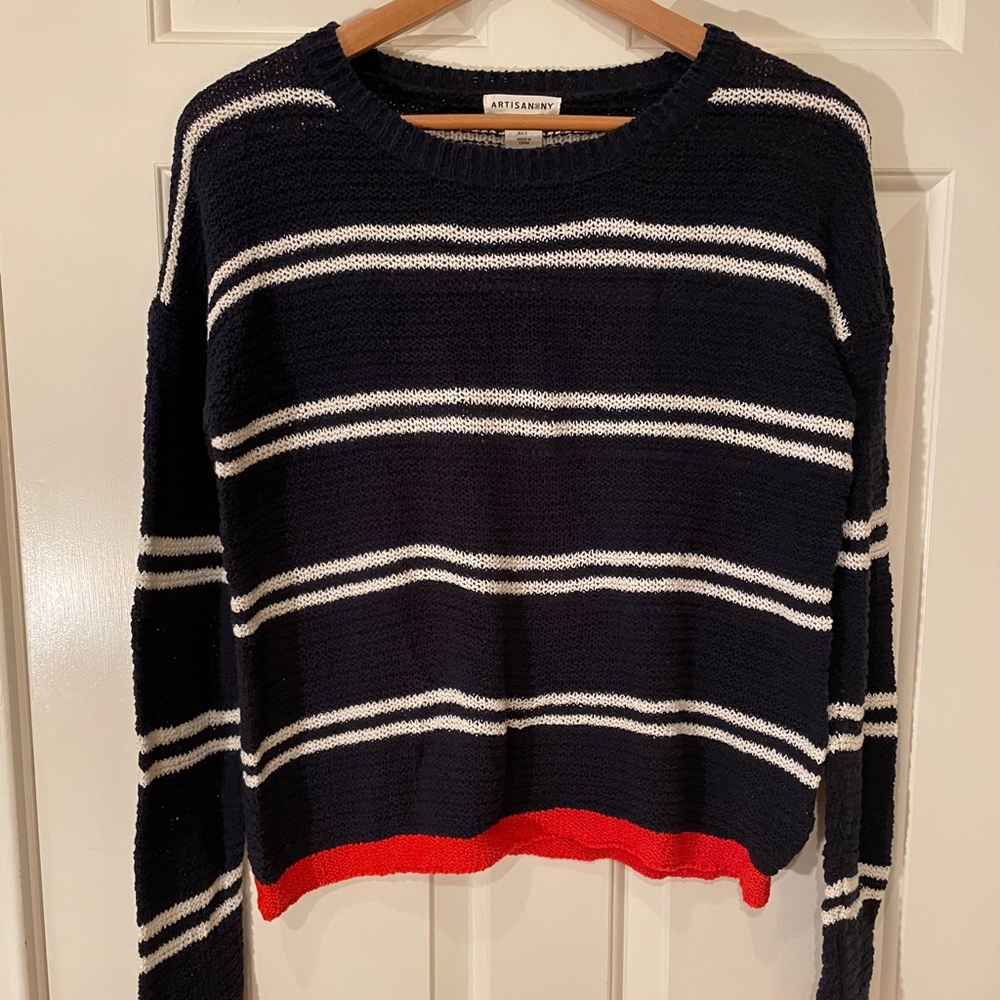 Navy and white striped sweater with pops of orange
